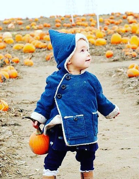 Halloween baby picking pumpkins