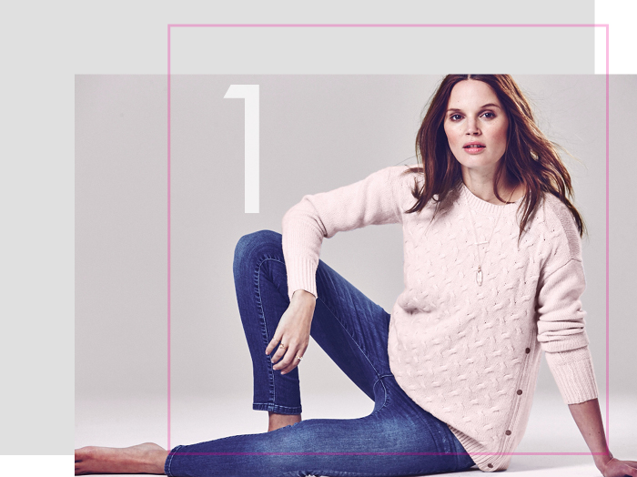 Pregnant model wears a pink Seraphine maternity jumper