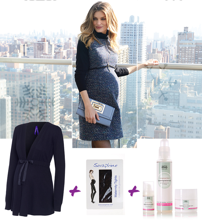 Pregnant woman wears a blue maternity dress against a New York skyline backdrop