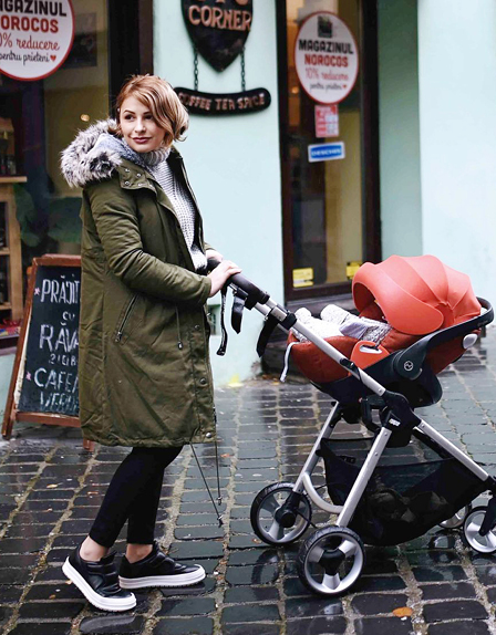 Fashion blogger wears the Seraphine maternity parka