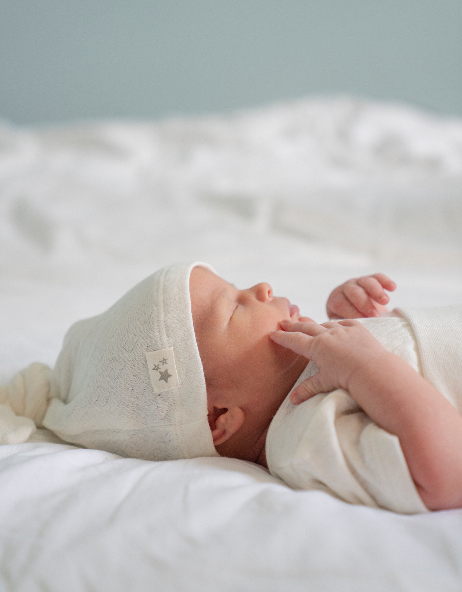 Newborn baby wearing Seraphine Baby Organic cotton baby clothes