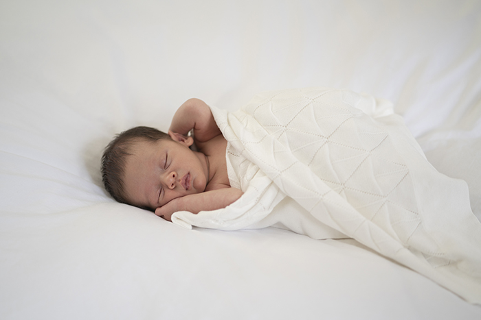 new born baby in a blanket - baby name trends