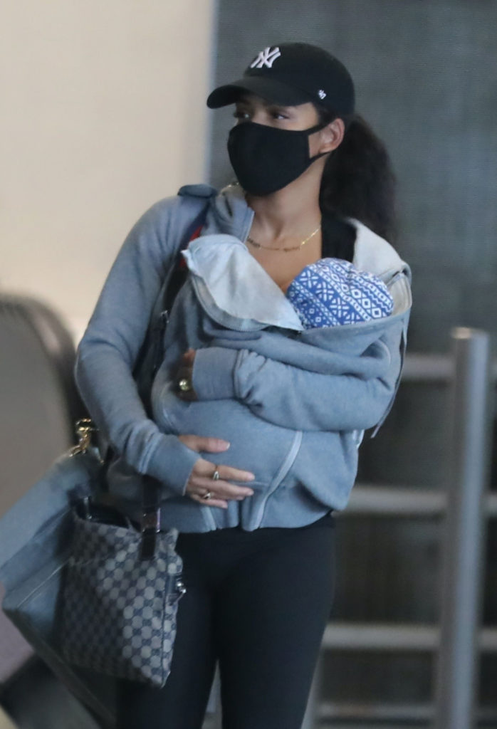 Christina Milian carries her son Isiah in a Seraphine babywearing Hoodie